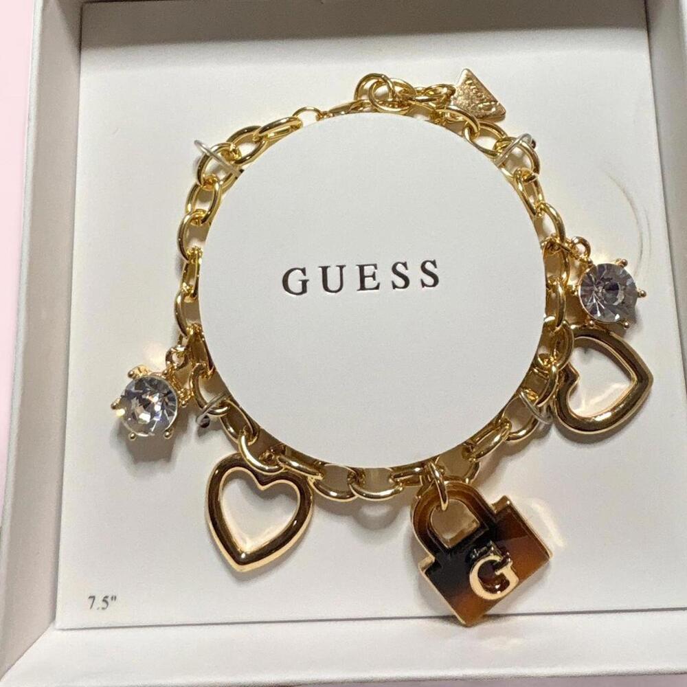 Guess Gold Tone Charm Bracelet with Hearts and Lock